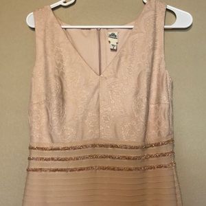 Long form fitting champagne colored dress